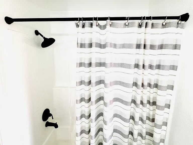 Full size primary bathroom with matte black fixtures