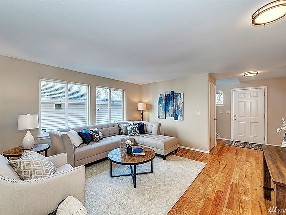 Hang your coat in the entry closet, and step into the large, light filled front room with tons of potential as a formal living or dining room.