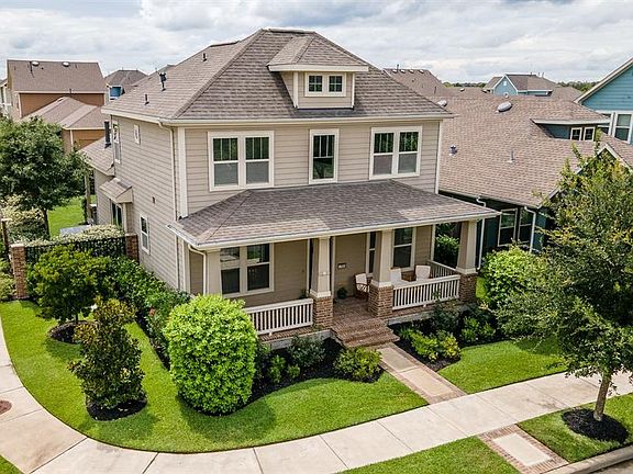 This home is surrounded by a lush lawn and magnificent foliage offering such great curb appeal!