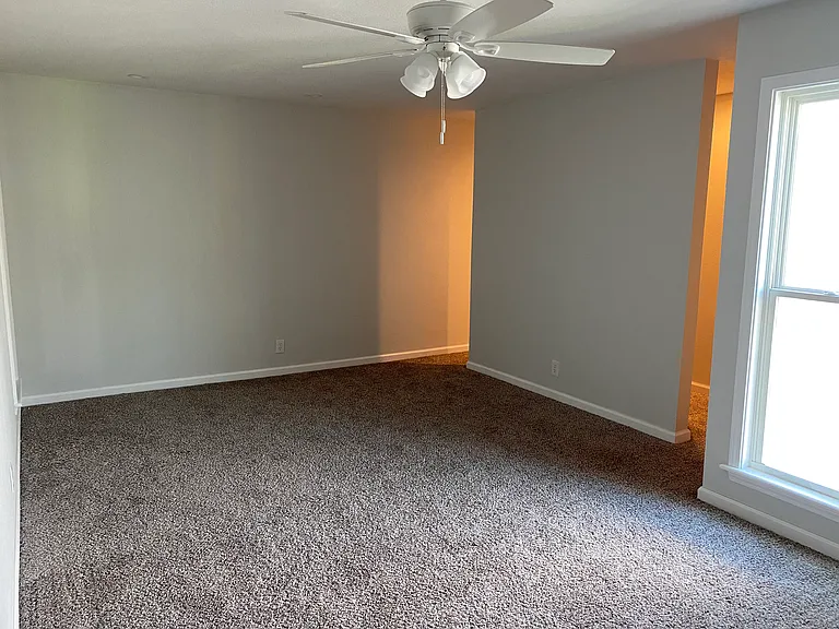 Walk through closet behind wall.