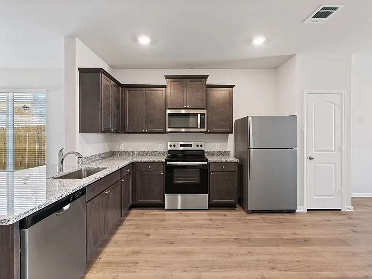 The kitchen has energy-efficient appliances.