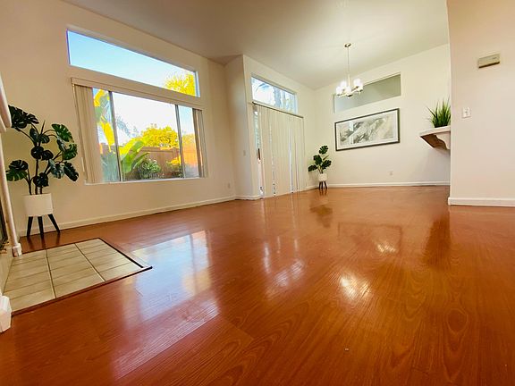 high ceiling living room with a lot of natural light to cheer up your mood
