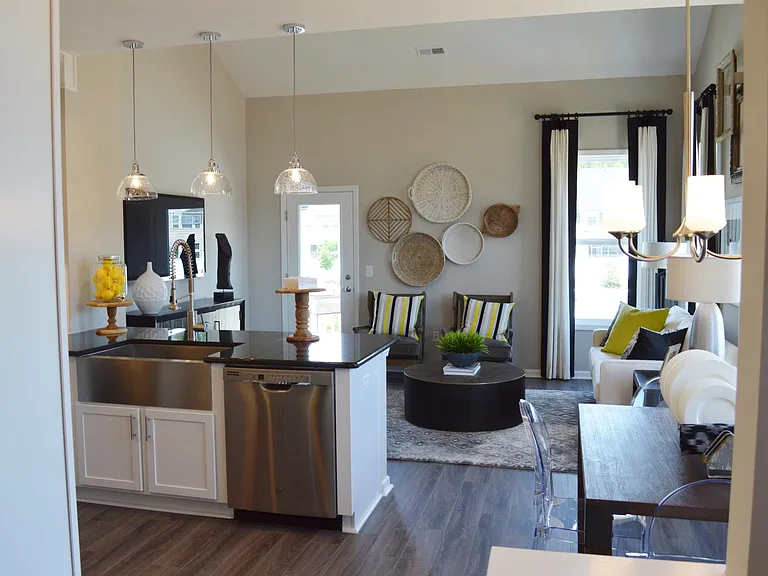 The kitchen opens to a beautiful living room with vaulted ceiling and tons of natural light.