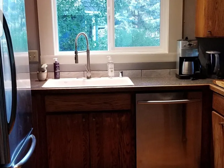 Kitchen sink area. Cafe curtains have been put up since this photo was taken.