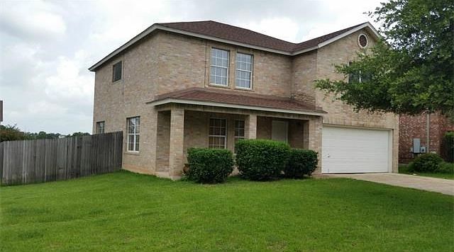 100% brick 2 story on large corner lot - backs to greenbelt