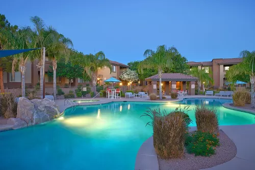 Resort-style pool with blue shade, gazebo, and spa. - Silverbell Springs