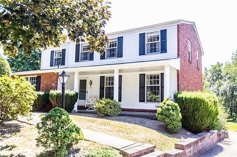 The welcoming landscape entrance is highlighted by white pillars covering your front porch