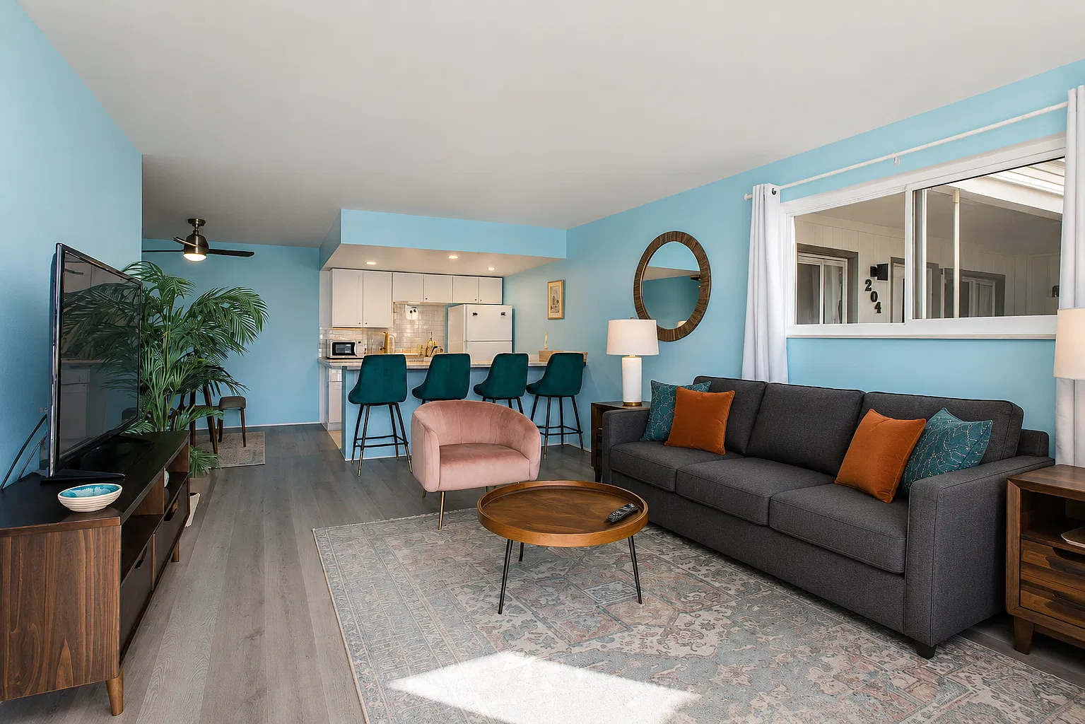 This vibrant living space opens effortlessly into the kitchen and dining area, making it easy to gather, cook, relax _ or do it all at once.