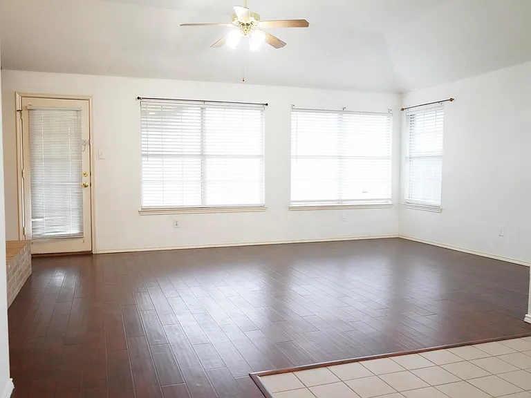 Large family room with door to backyard.