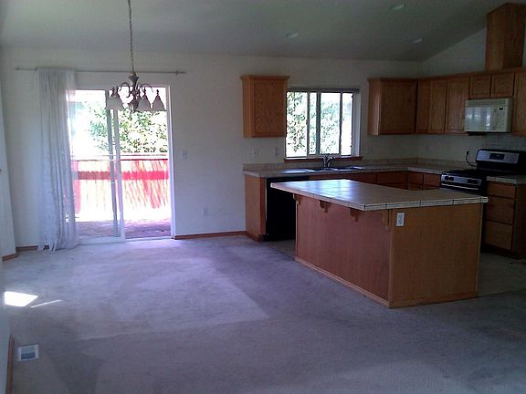Convenient kitchen is open to great room and dining area and