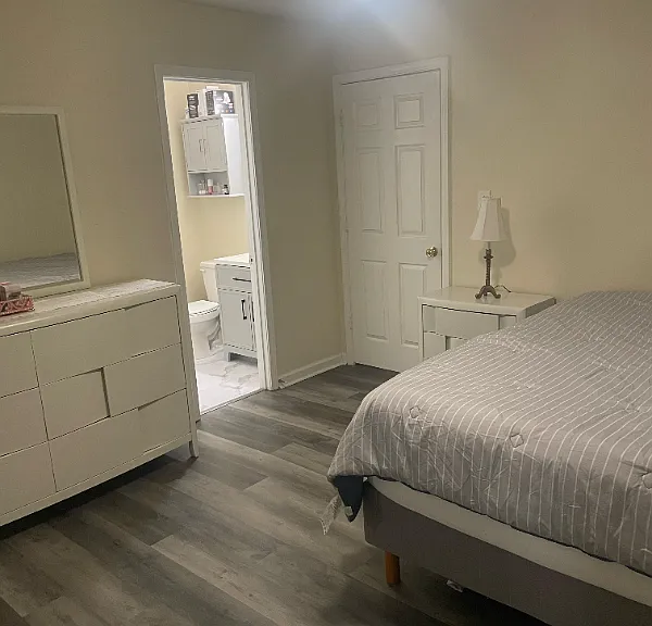 Back bedroom with view into bathroom
