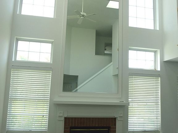 Soaring ceiling, 2 story, skylights, brick front Fireplace, ceiling fan.