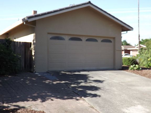 Paved area for three cars.