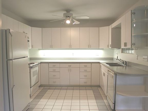 Kitchen features loads of cabinet and counter space plus pantry.