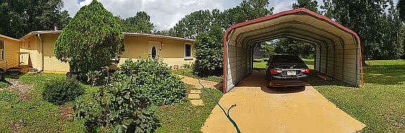 OUTSIDE  HOUSE WITH CAR PORT