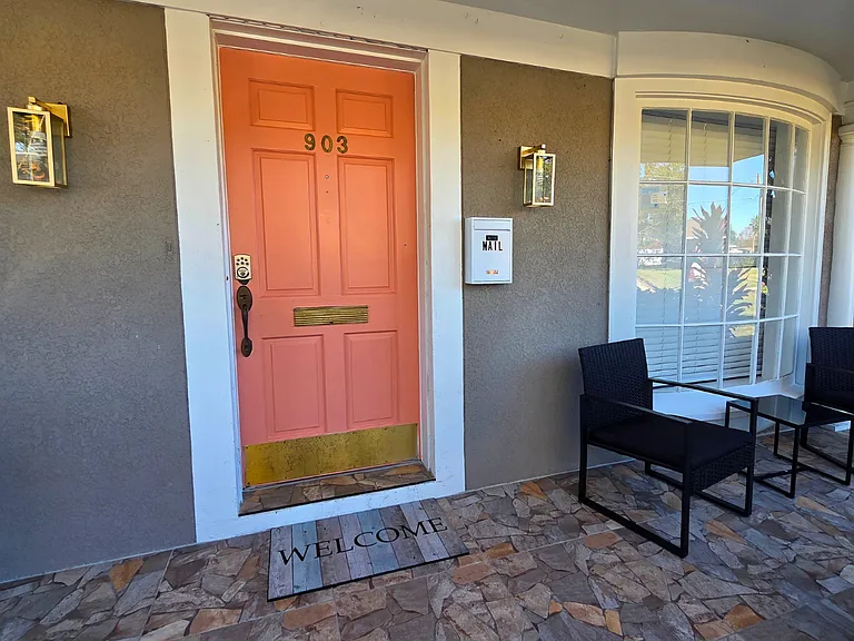 Beautiful entry decor with stylish accents and a welcoming mat.