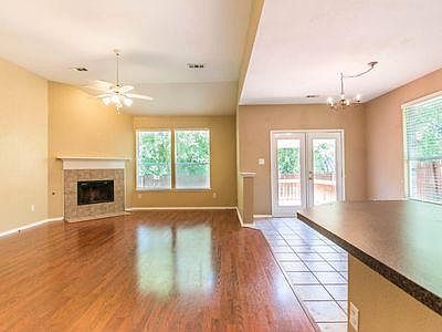 Family Room with Fireplace and Dinette Access to Backyard