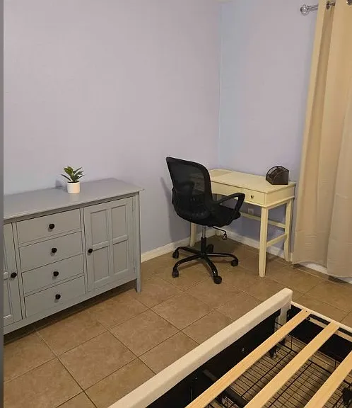 When you first enter your private suite, you'll be greeted by the cabinet with drawers, a TV for your entertainment, and a small desk area ahead _ perfect for working, studying, organizing, or adding your personal touches.