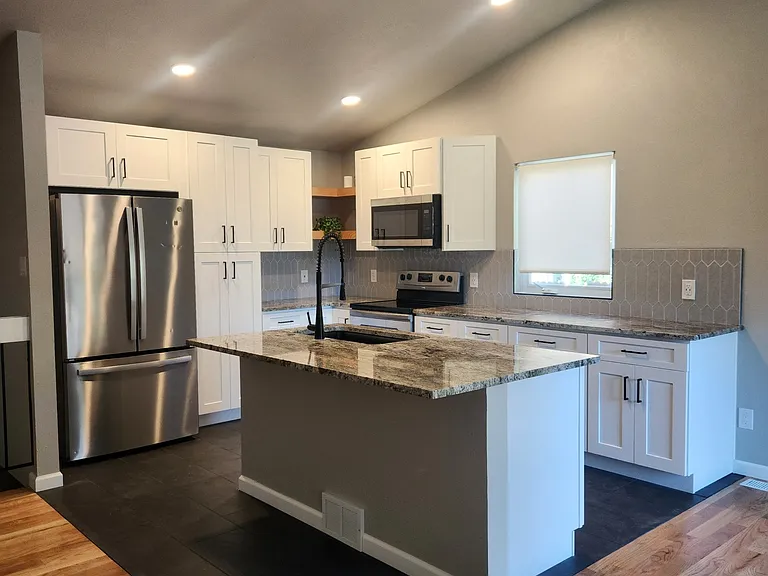 Brand new kitchen with counter seating.