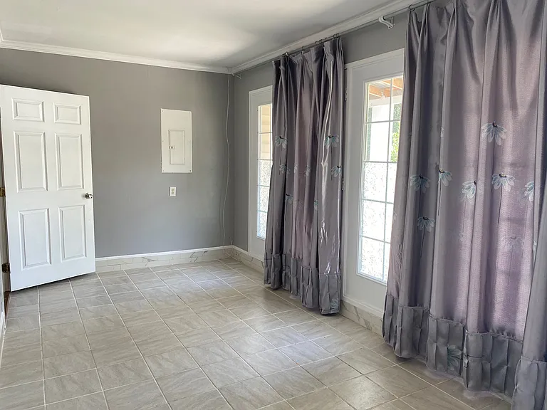 Spacious air-conditioned flex room offering extra living space. Ideal for a home office, game room, media room, guest area, or additional storage