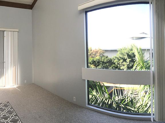 Living room- Large windows, Patio with Ocean View, Kitchen overlooks living room