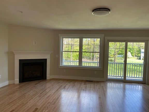 Living room with gas fireplace and deck