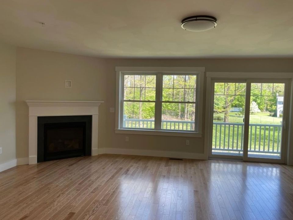 Living room with gas fireplace and deck