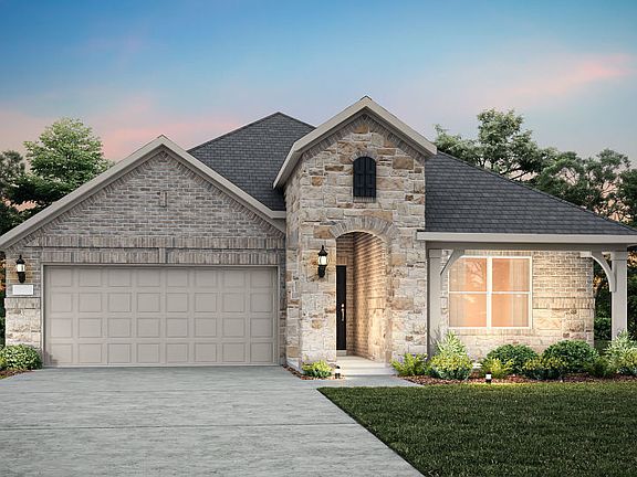 The Bell, a one-story home with 2-car garage, shown with Home Exterior D
