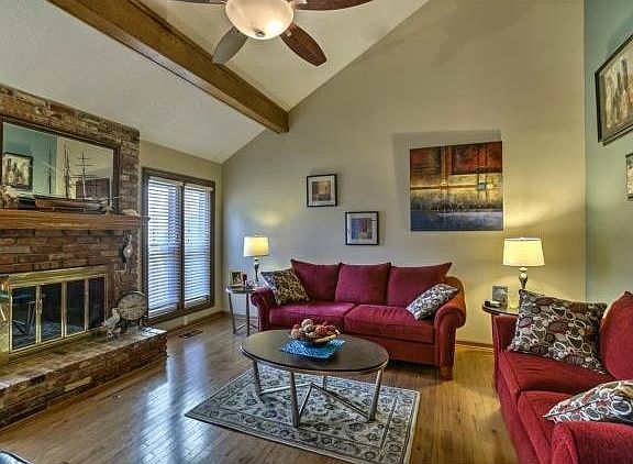 Living room-wood fireplace with gas starter, ceiling fan and vau