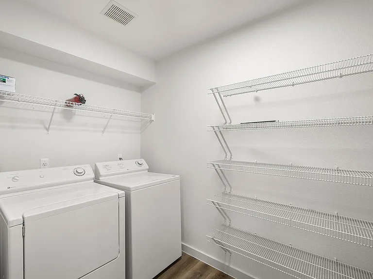 Pantry + laundry room with washer dryer, and plenty of shelf space