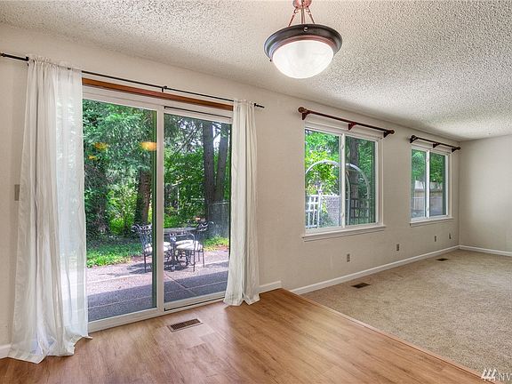 View from kitchen of living room and reading nook.