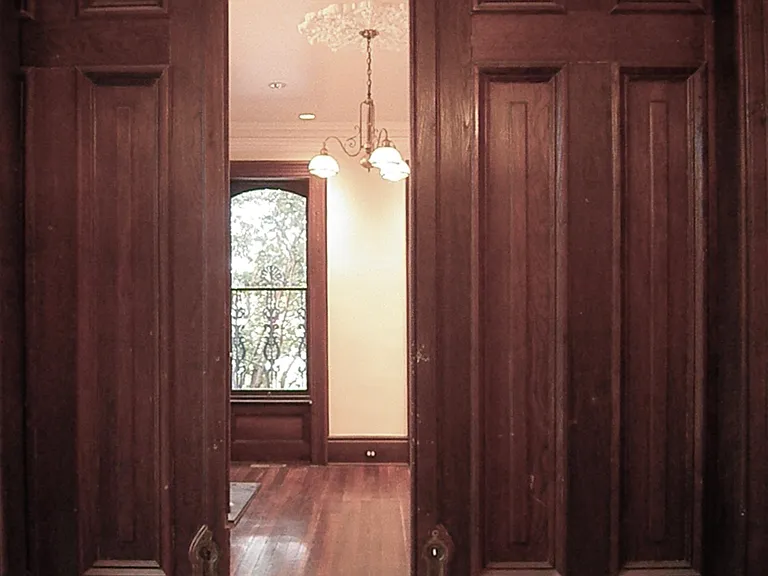 9.5' Pocket doors separating living room and dining room.