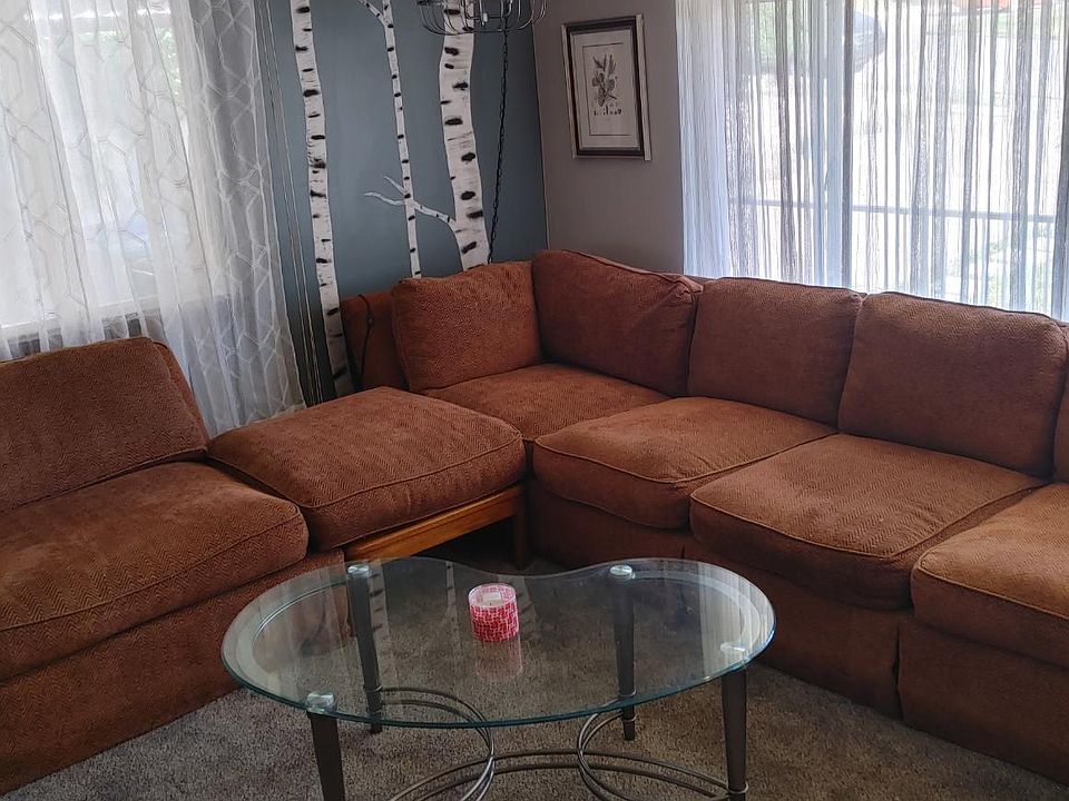 Front Room with couch and custom mural