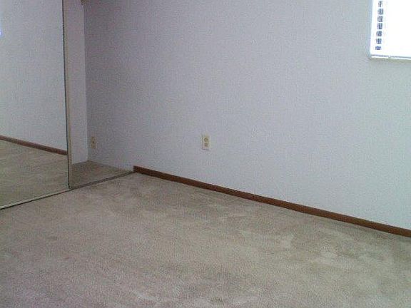 Bedroom with mirror closet doors