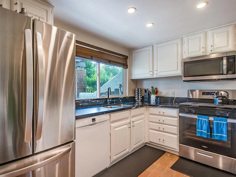 New fridge, sink, dishwasher, range, microwave, granite countertops.