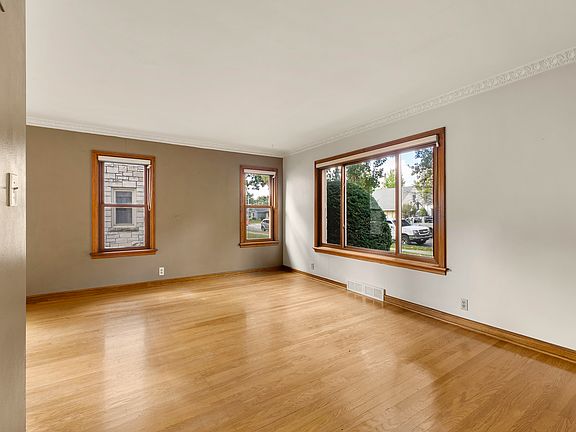 Living room looking to side and front of home
