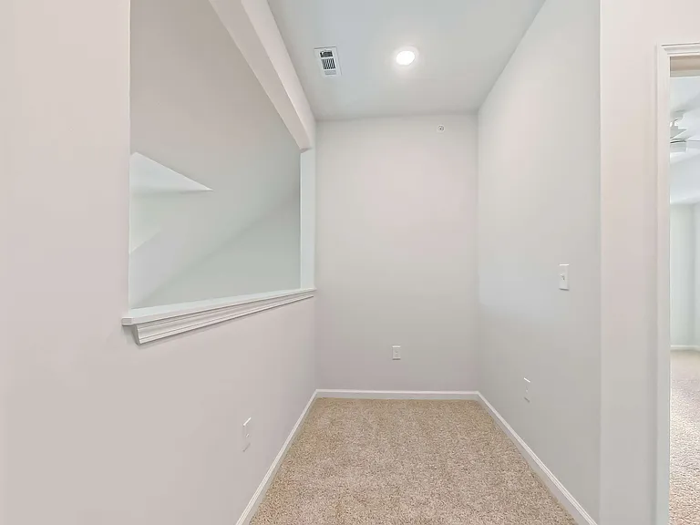 Bright loft overlooking the living room - perfect for an office or hobby corner.