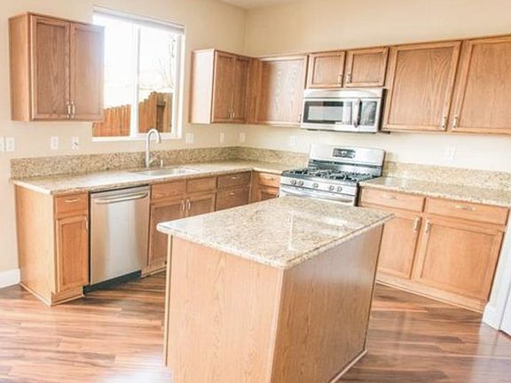 Granite countertops and stainless steel appliances.