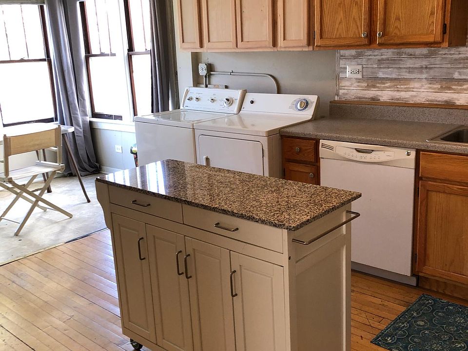 I just added cabinets above the washer and dryer that will be stained and finished to match.