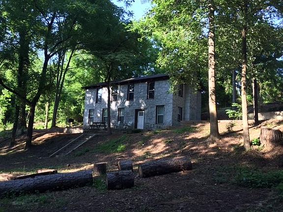 Exterior Front View, with great tree canopy