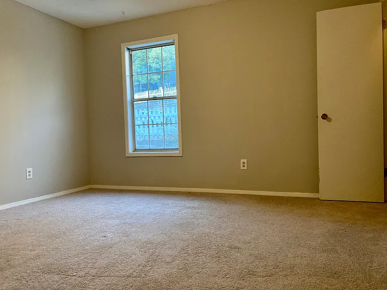 ensuite master bedroom with walk-in closet and a second closet