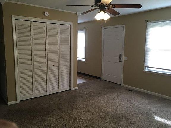 Another view of living room. Washer/dryer hookup behind bifold doors.