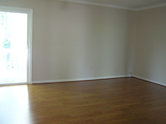 Great Room with Laminate Floors and view to deck/back yard.