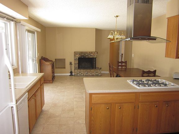 KITCHEN, EATING AREA/FAMILY AREA, AND FIREPLACE