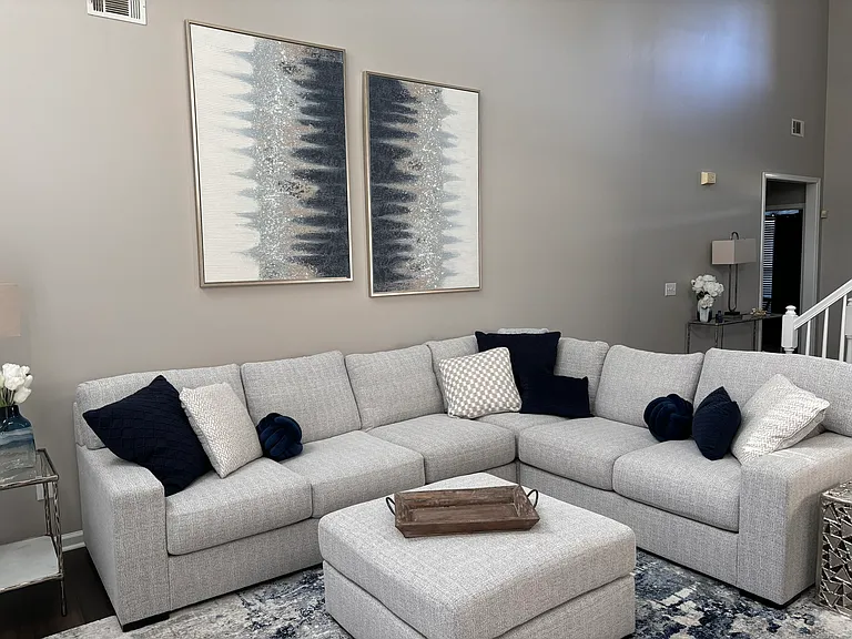 Large 2 story living room with lots of natural light!