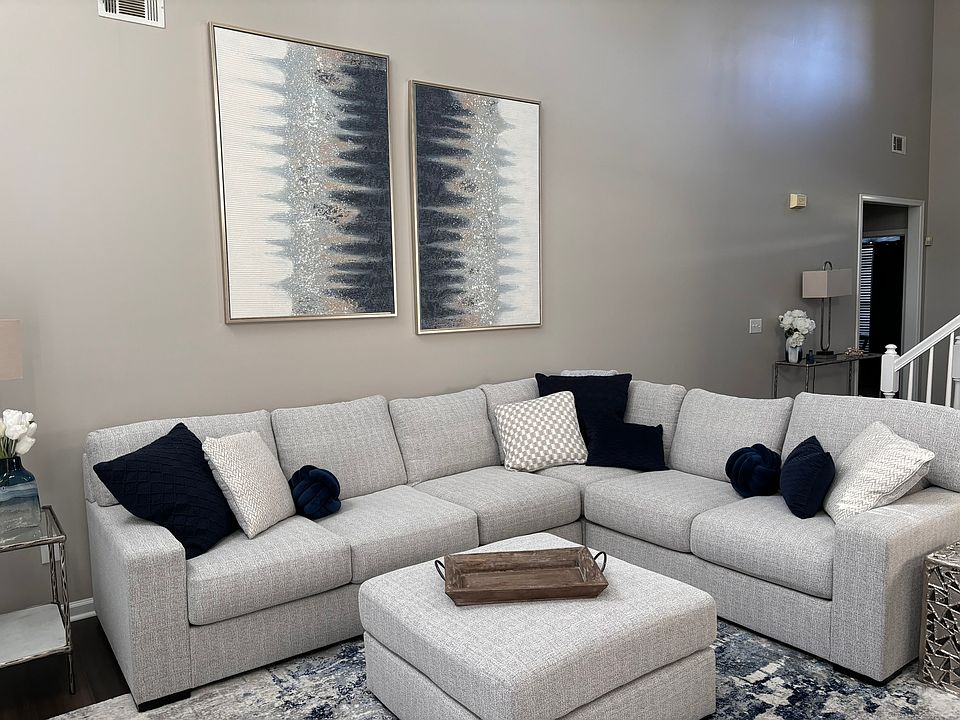 Large 2 story living room with lots of natural light!