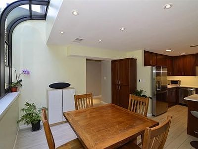 The dining area is the front door & 1/2 BA. The unique window gives year-round sun & lake views in the winter. 

2 parking spots (1 reserved) are in front. The street is lower than the home so no car lights in your kitchen.