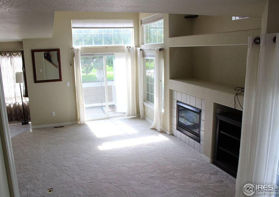 Living room with gas fireplace and looking to patio doors fr