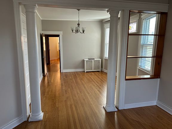 view from living room to dining room; built-in shelves.