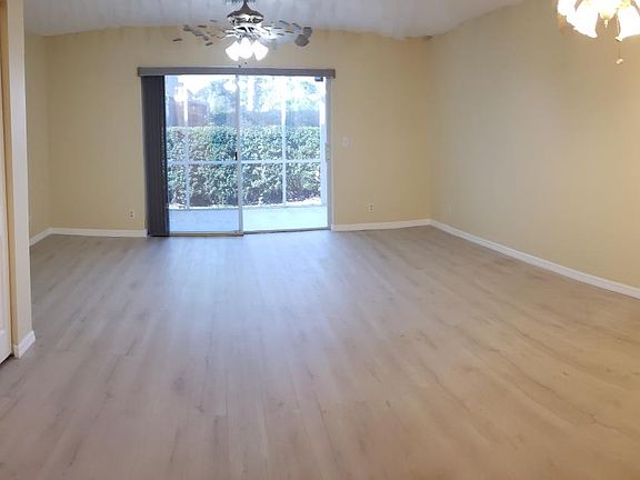 Living room looking out to screened patio.